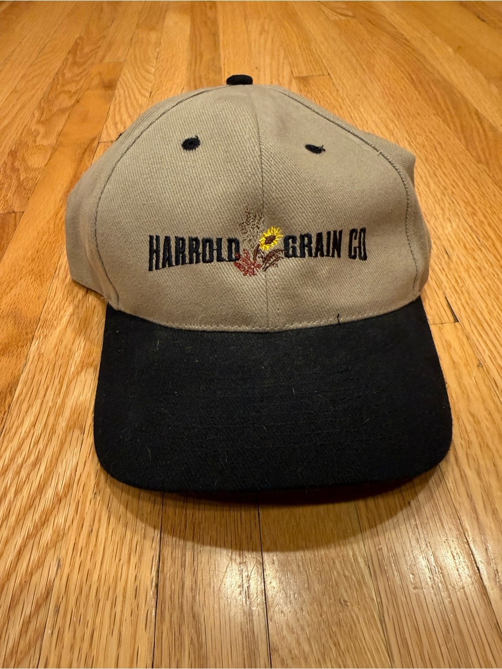 Harrold Grain Company Tan and Black Logo Baseball Style Hat